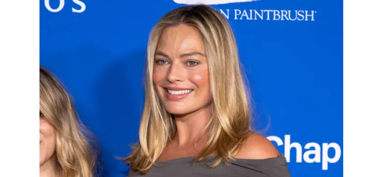 Pregnant Margot Robbie stuns at red carpet debut with baby bump.