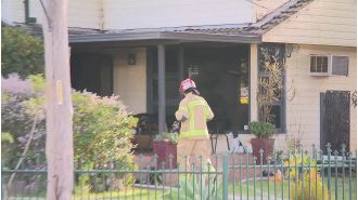 Child hospitalized following house fire in Sydney under unclear circumstances.