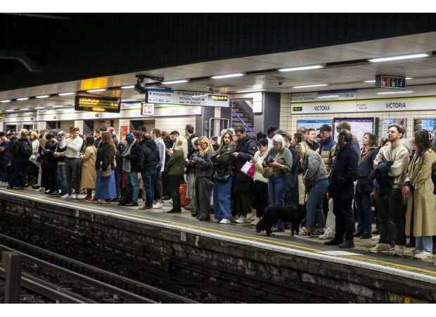 London commuters experiencing long delays due to engineering work during rush hour.