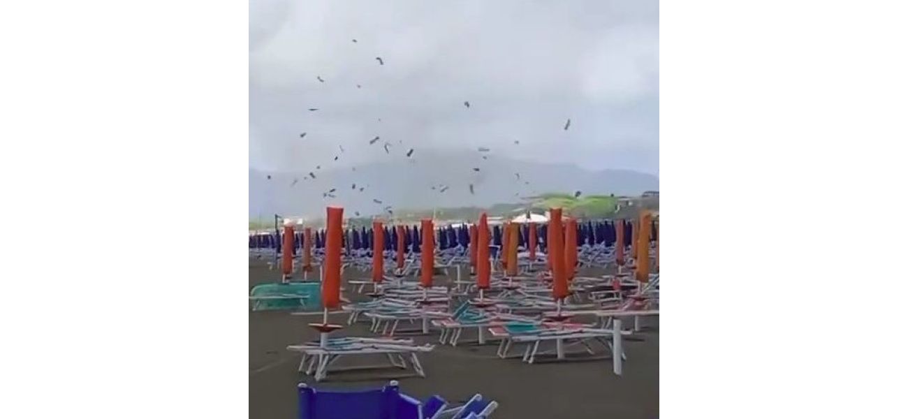 A sudden tornado on an Italian beach caused sunbeds and parasols to be thrown into the air.