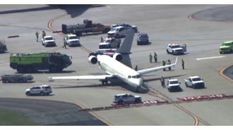 A small plane's tail is damaged by a larger plane during takeoff.