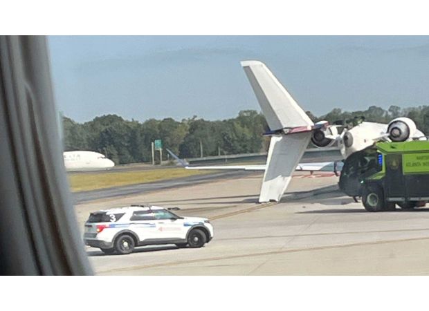 Two planes crash on runway at crowded US airport.