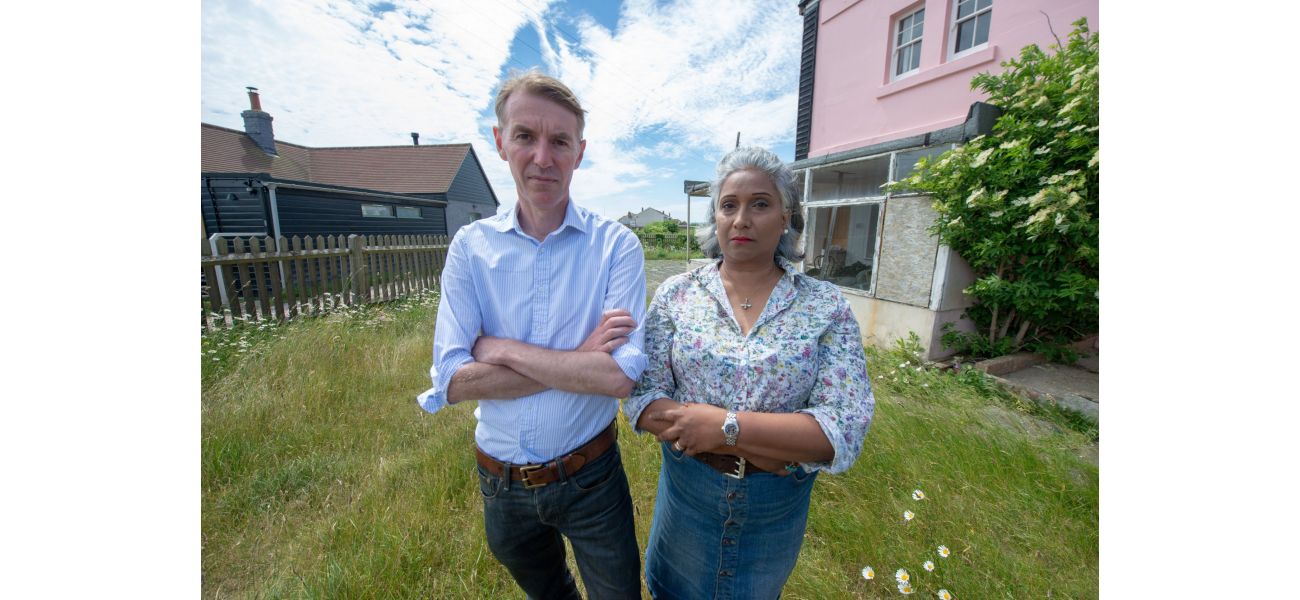 A couple who were forbidden from viewing their neighbor's house are no longer facing charges.