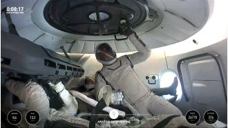 See live footage of billionaire's first private spacewalk ever.