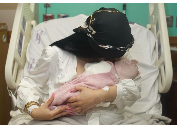 Celebrity rapper, age 31, shares intimate photos of giving birth and breastfeeding to announce new arrival.