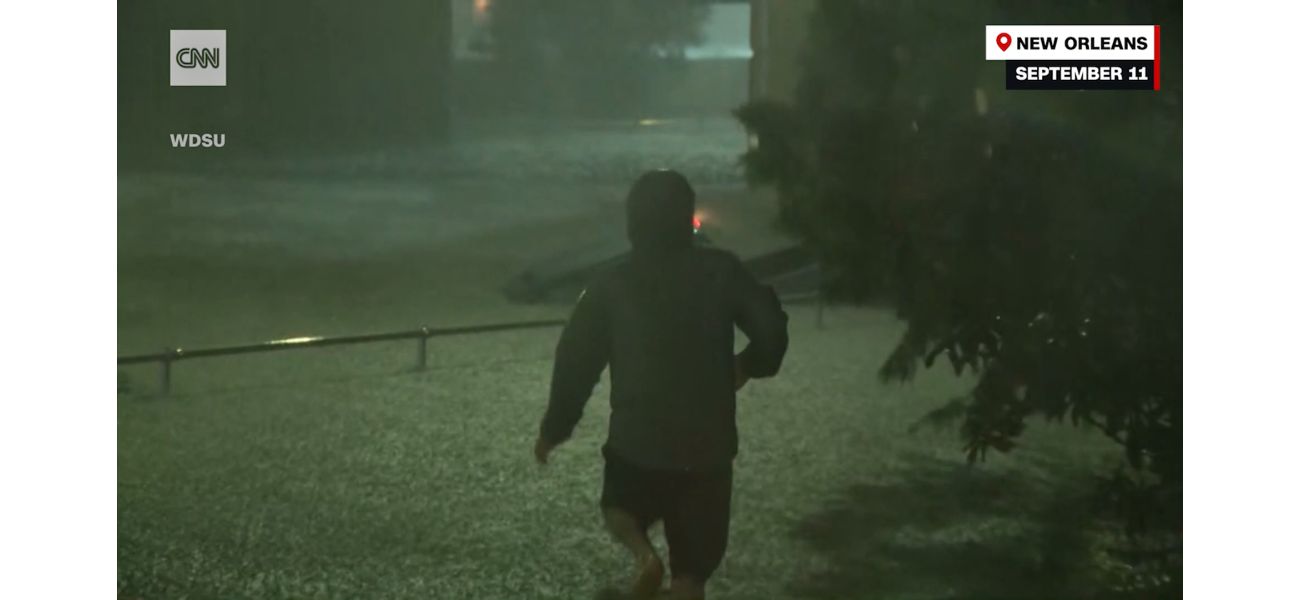 As cops hesitate, passerby jumps into floods for daring rescue.