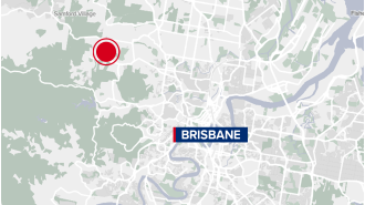 Body discovered in rural wooded area near Brisbane's outskirts.