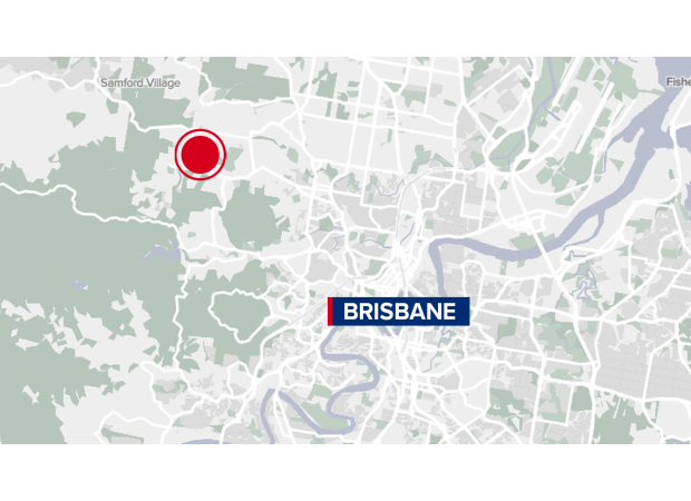 Body discovered in rural wooded area near Brisbane's outskirts.