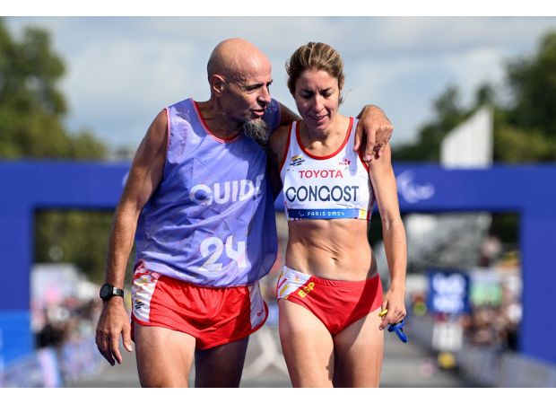 Paralympic runner shares financial losses due to disqualification in marathon.