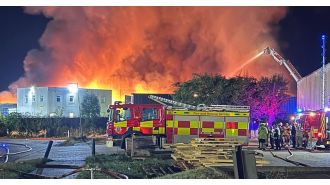 Massive fire raging at recycling facility could continue for entire weekend.