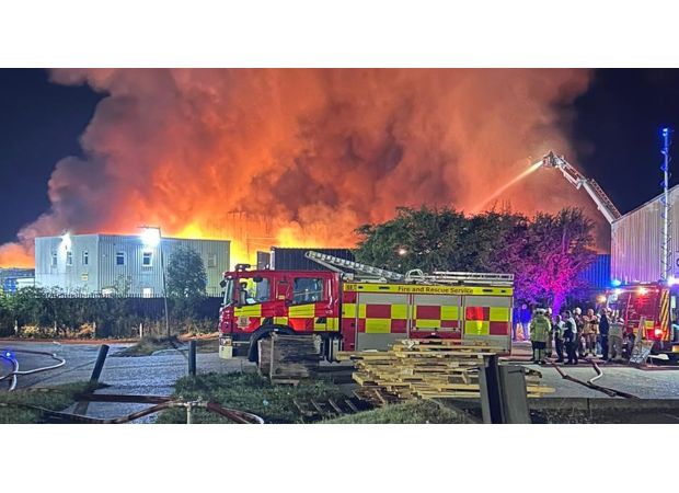Massive fire raging at recycling facility could continue for entire weekend.