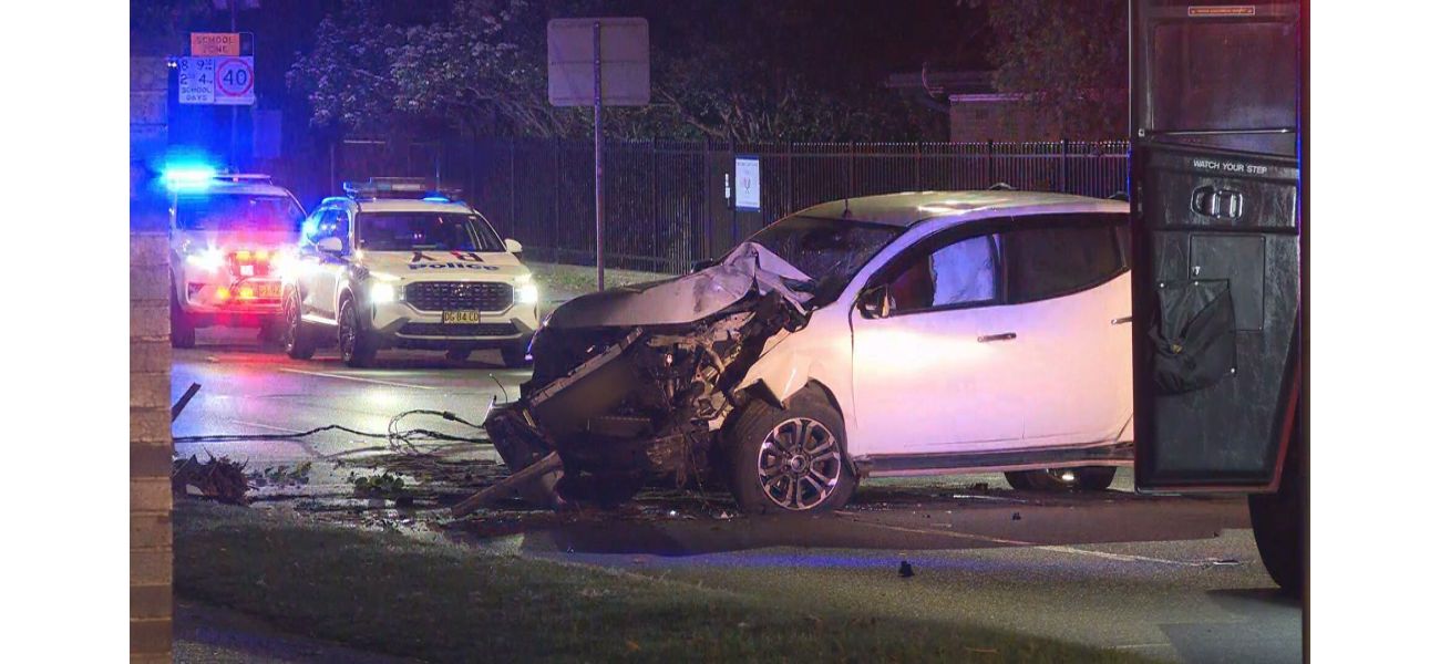 Drunk driver in Sydney crashes into pole, but is unharmed.