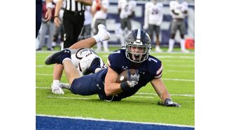 Colorado School of Mines' football team narrowly avoids being upset by Washburn, maintaining their undefeated record.