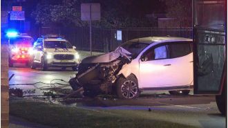 Drunk driver in Sydney crashes into pole, but is unharmed.