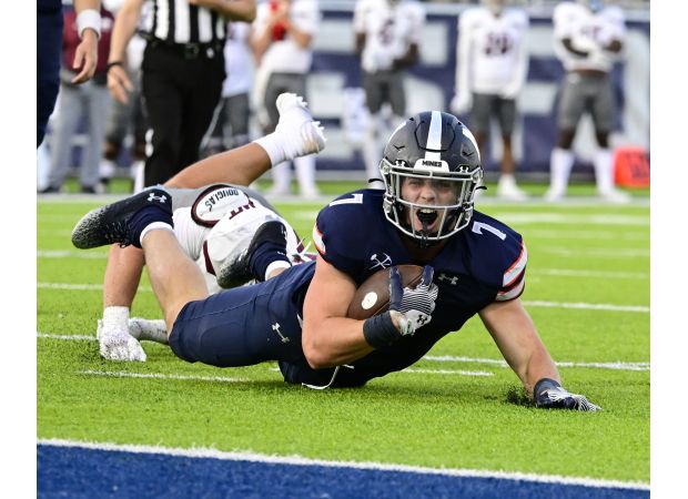 Colorado School of Mines' football team narrowly avoids being upset by Washburn, maintaining their undefeated record.