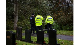 Police have sectioned off an area near a cemetery after discovering human remains.