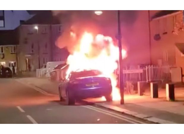 Car catches fire on London street, parked illegally.