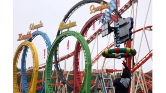 A 20-year-old man died when a rollercoaster wagon at Oktoberfest swung at a high speed.