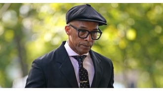 Jay Blades, a BBC personality, appears dejected heading to court over a traffic violation.