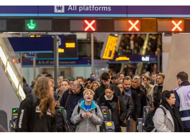 Fire near London train tracks causes major disruption at busy stations.