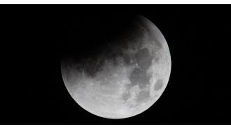 Catch a glimpse of the rare supermoon partial eclipse in the UK tonight with these tips.