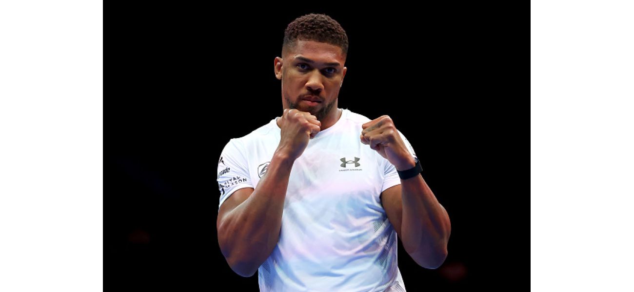 Boxer Anthony Joshua takes a swipe at someone who accused him of getting weak knees while sparring with Daniel Dubois.