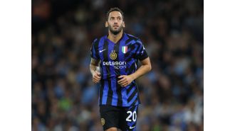 Inter Milan player Hakan Calhanoglu criticizes the atmosphere at Etihad Stadium after their draw against Manchester City.