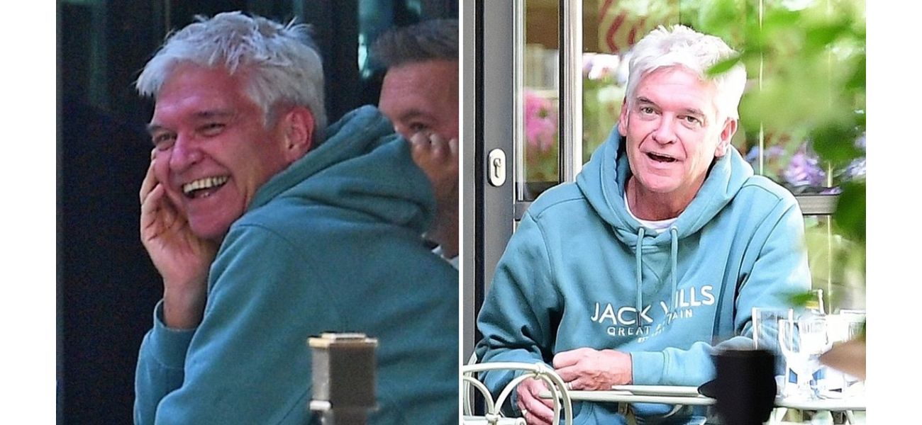 Excited Phillip Schofield spotted wearing wedding ring with happy expression.