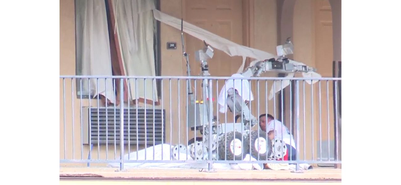 A man battling a police robot is hit with tear gas and run over by it.
