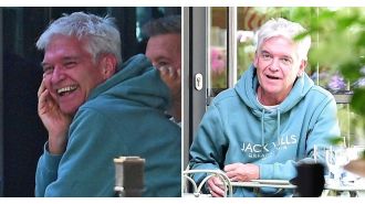 Excited Phillip Schofield spotted wearing wedding ring with happy expression.