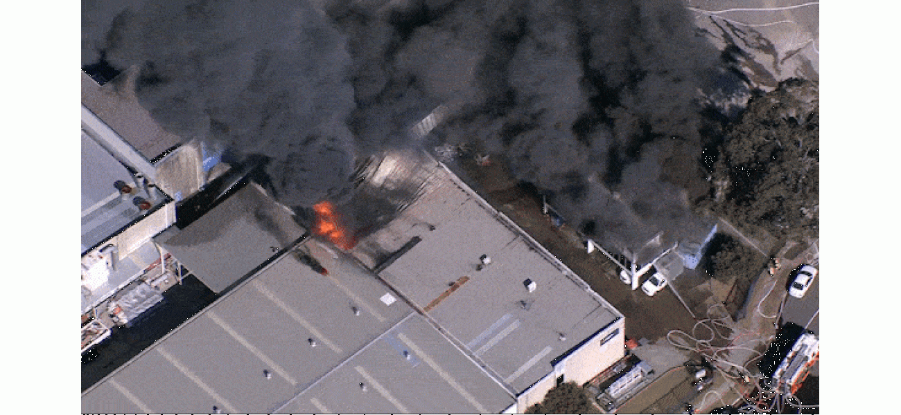 Large fire in Sydney produces thick smoke in the south-west area.