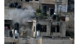 Israeli soldiers forcefully removed dead bodies from rooftops during a West Bank operation.