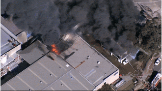 Large fire in Sydney produces thick smoke in the south-west area.