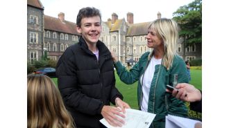 DJ Zoe Ball's son is glad to see her happy despite her unexplained absence from BBC Radio 2.