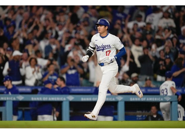 Shohei Ohtani made history in Dodgers' 6-4 win over Rockies, hitting a home run and stealing a base in the same game, setting a new MLB record.