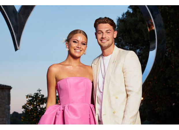 Fan-favorite ignores 'curse' gossip, praises her boyfriend as the most attractive man on Earth.