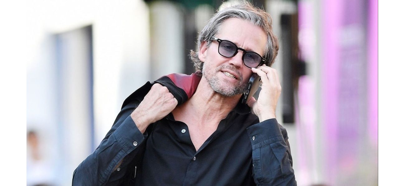 Former 90s pop star caught on camera receiving parking violation.