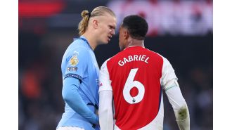 Erling Haaland taunts Gabriel with cheeky goal celebration during Arsenal match.