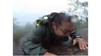 Hiker falls down mountain, records incident on camera.