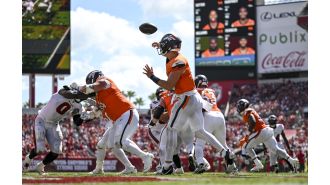 Broncos triumph over Buccaneers with 26-7 victory in photos.