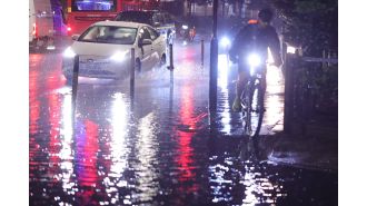 Travel disruptions as flooding affects both Tube lines and motorways for commuters.