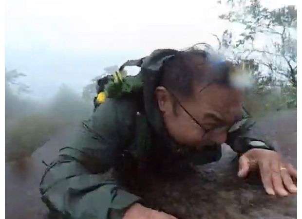 Hiker falls down mountain, records incident on camera.