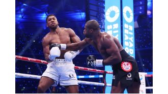 Trainer's instructions to Dubois before knockout criticized as risky.