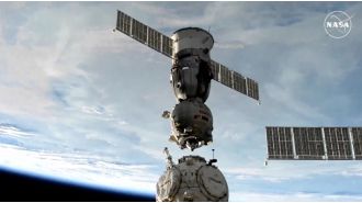 Two space travelers return to Earth after spending 374 days away.