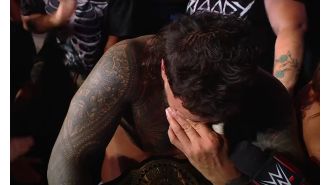 Wrestler emotional after 14-year wait for first singles title win.