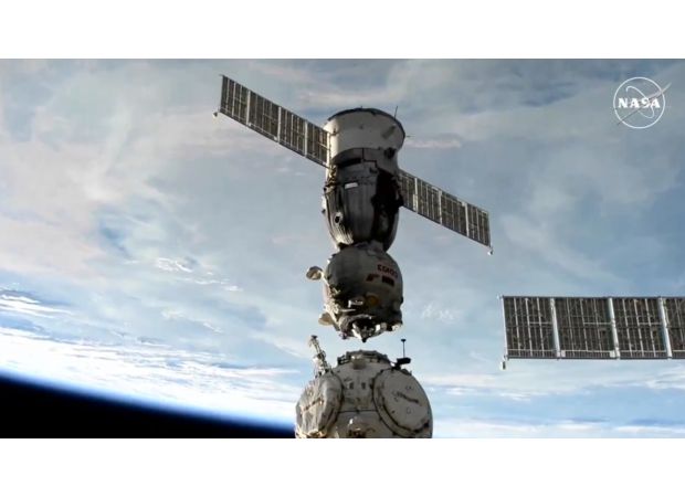 Two space travelers return to Earth after spending 374 days away.