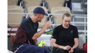 Tennis coach fired for verbally attacking Wimbledon winner, causing emotional distress.