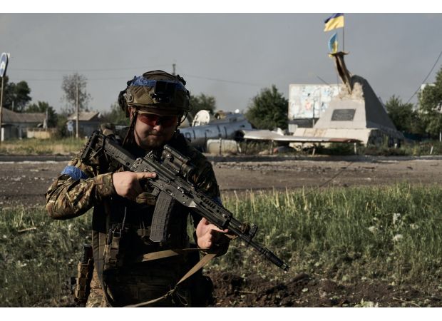Ukrainian forces regain strategic land after defeating Russians in close-range battle.