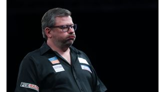 Darts player James Wade denies claims of 'sharting' during a match with a humorous statement.