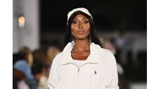 Supermodel Naomi Campbell loses charity role for using £7,800 of funds on luxury hotel stay.
